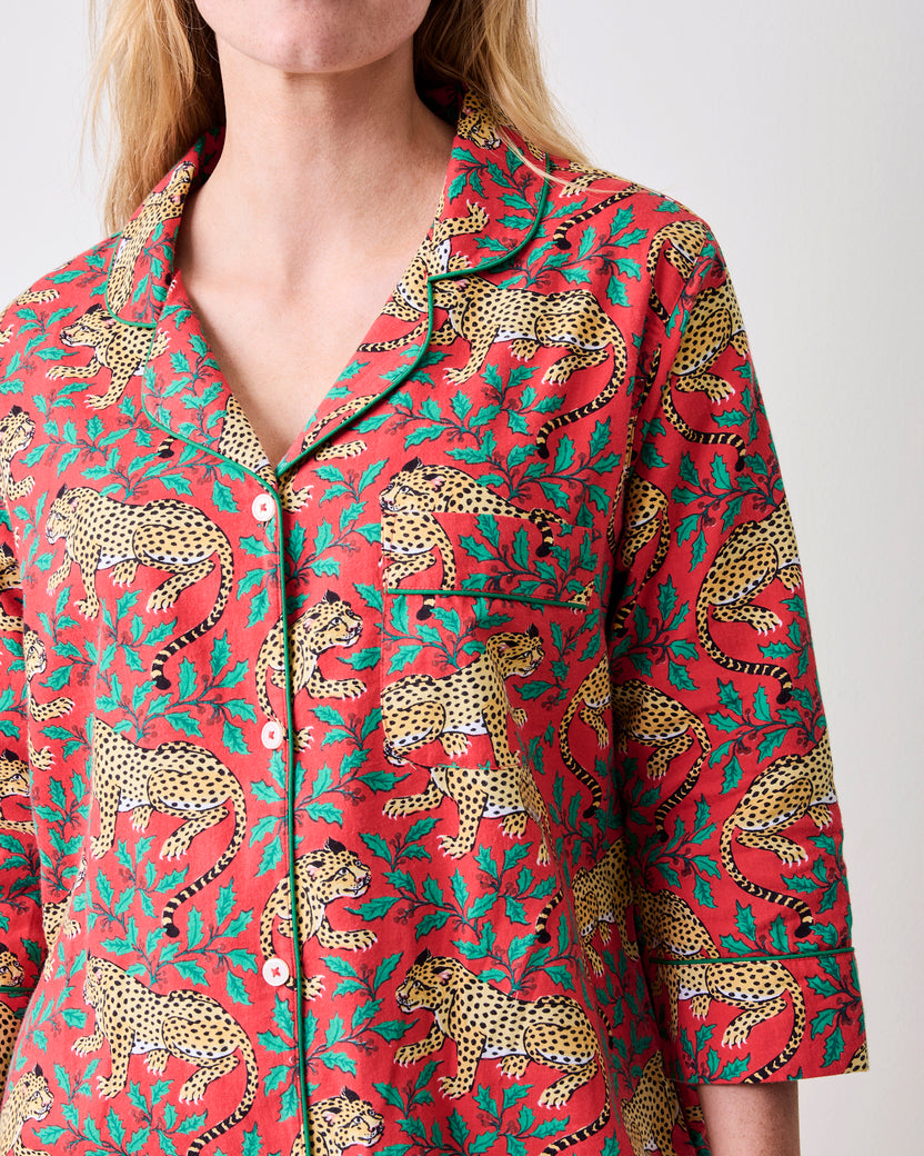 Close-up of the Ruby sleep shirt showing its collar, white buttons, chest pocket, three-quarter sleeve, and leopard-and-floral print