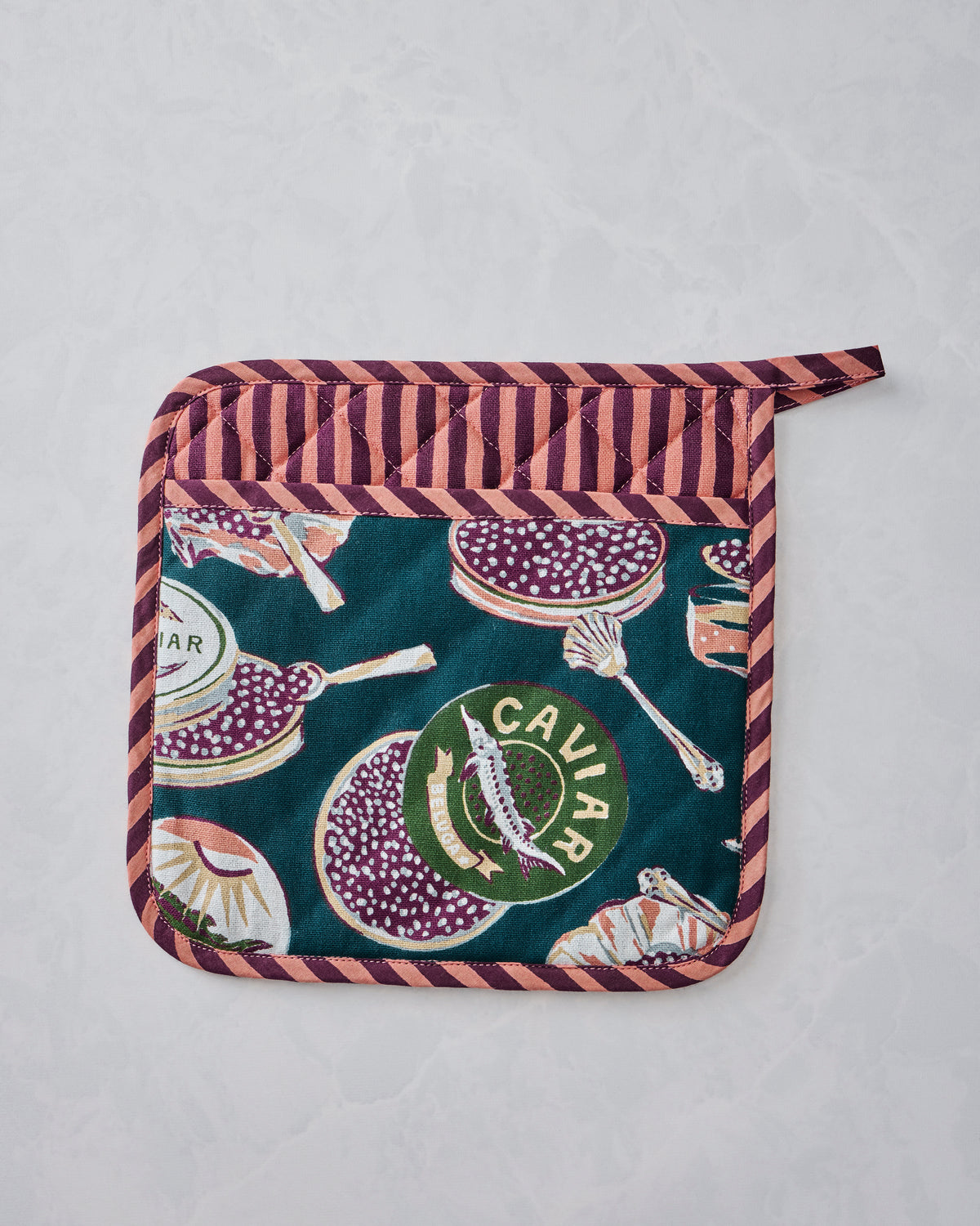 Champagne & Caviar pot holder displayed flat with a teal caviar-themed print and pink-and-brown striped trim.
