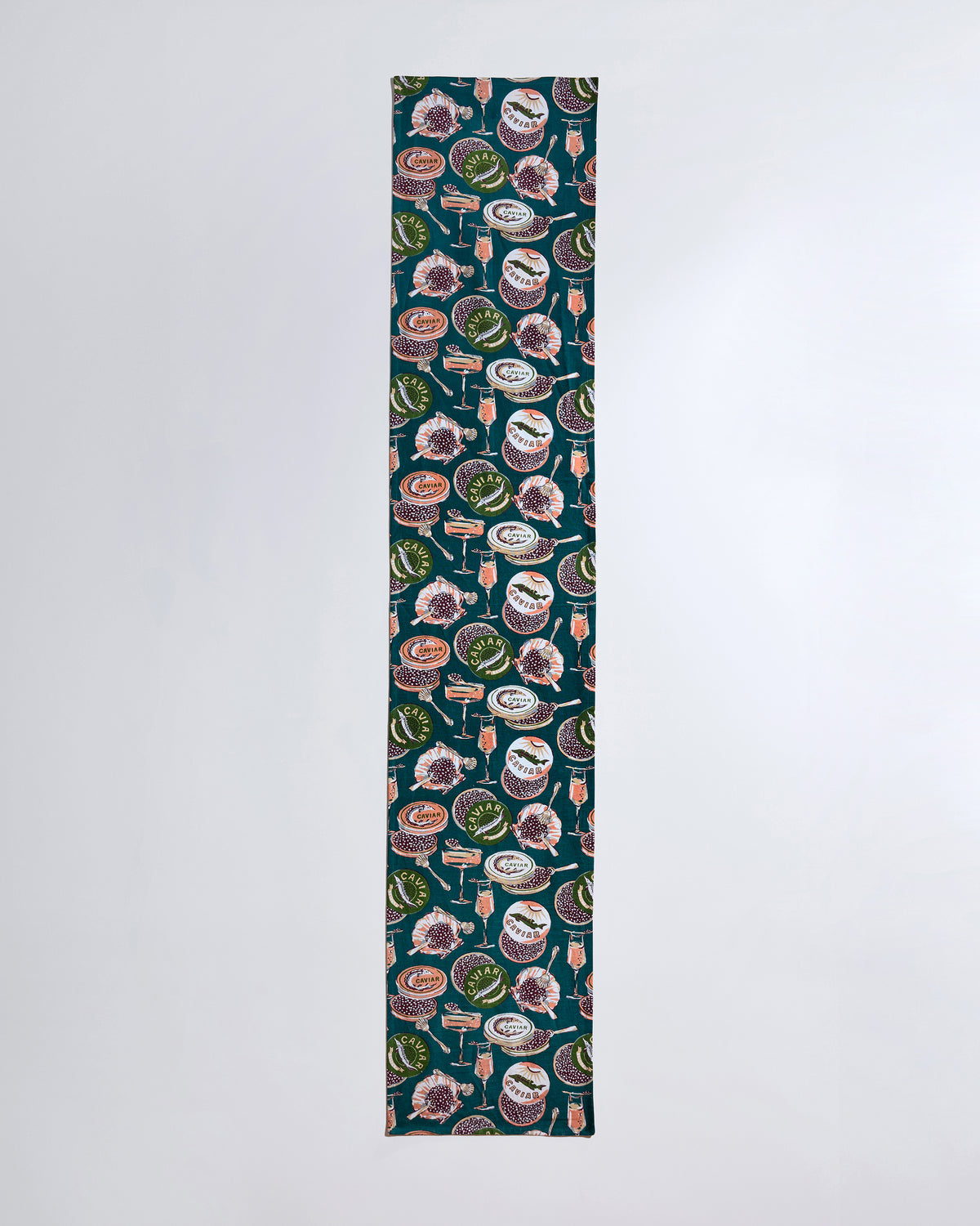 Champagne & Caviar table runner shown laid flat from end to end with a repeating caviar and champagne-themed print.
