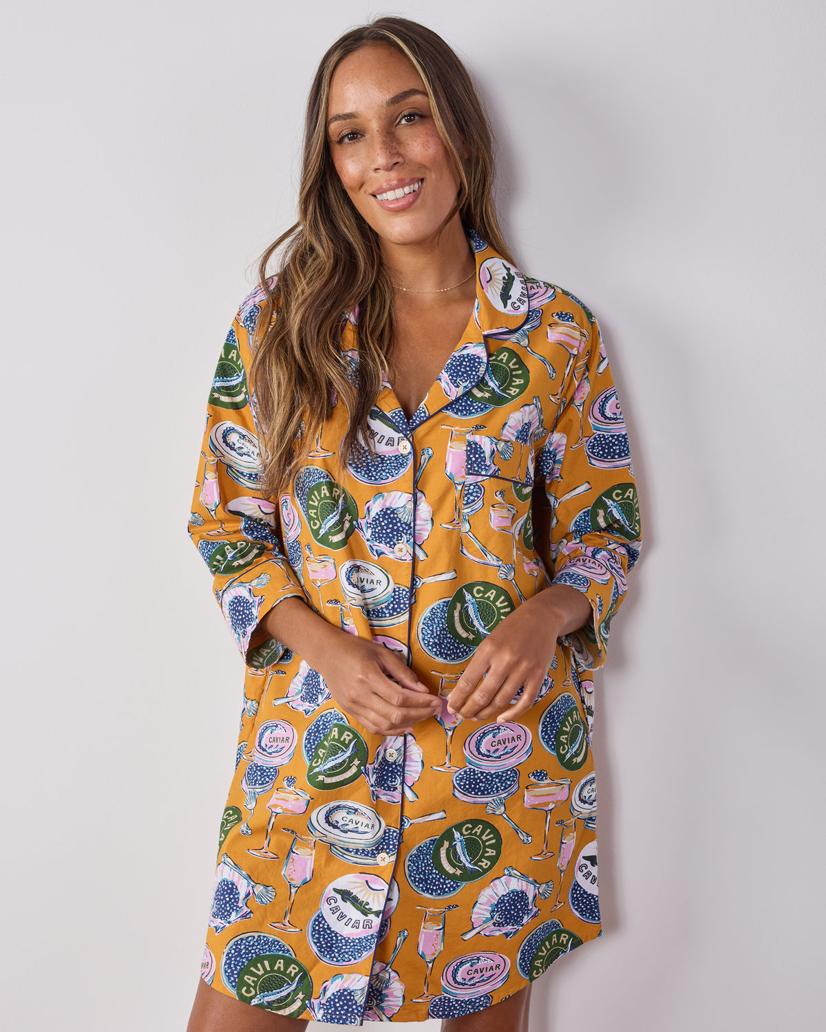 Front three-quarter view of the goldenrod Champagne & Caviar button-down sleep shirt with a collared neckline and three-quarter sleeves.