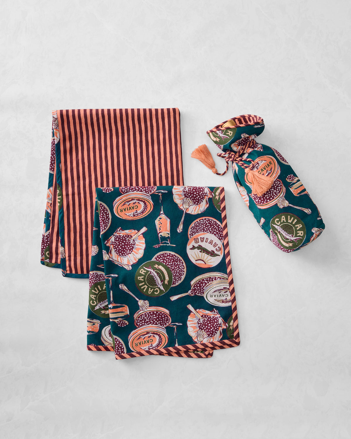 Champagne and caviar print wine bag with two coordinating tea towels, including one with vertical stripes.