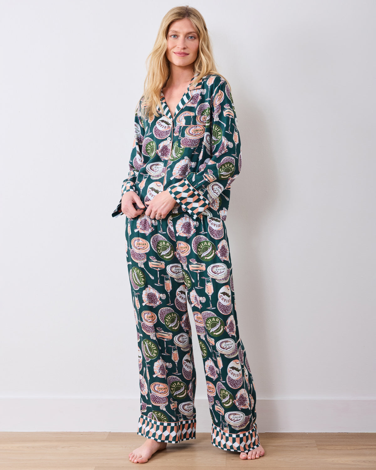 Front three-quarter view of the Champagne & Caviar Soho pajama set with a collared top, patterned cuffs, and wide-leg pants.