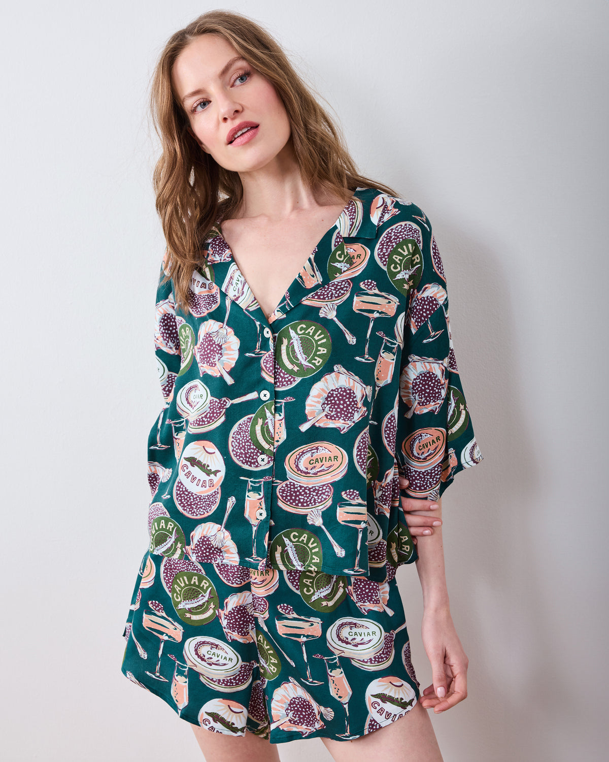 Front view of a short printed pajama set with a button-front shirt and matching shorts.