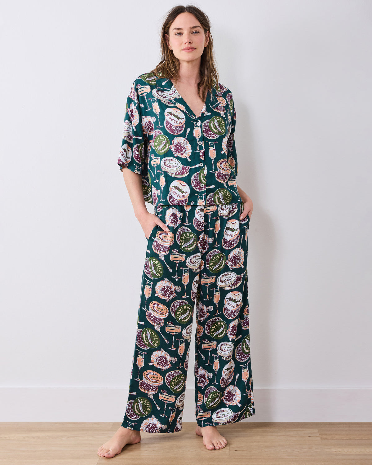 Full front view of the petite Champagne & Caviar Wildest Dreams pajama set with a short-sleeve button-front top and wide-leg pants.