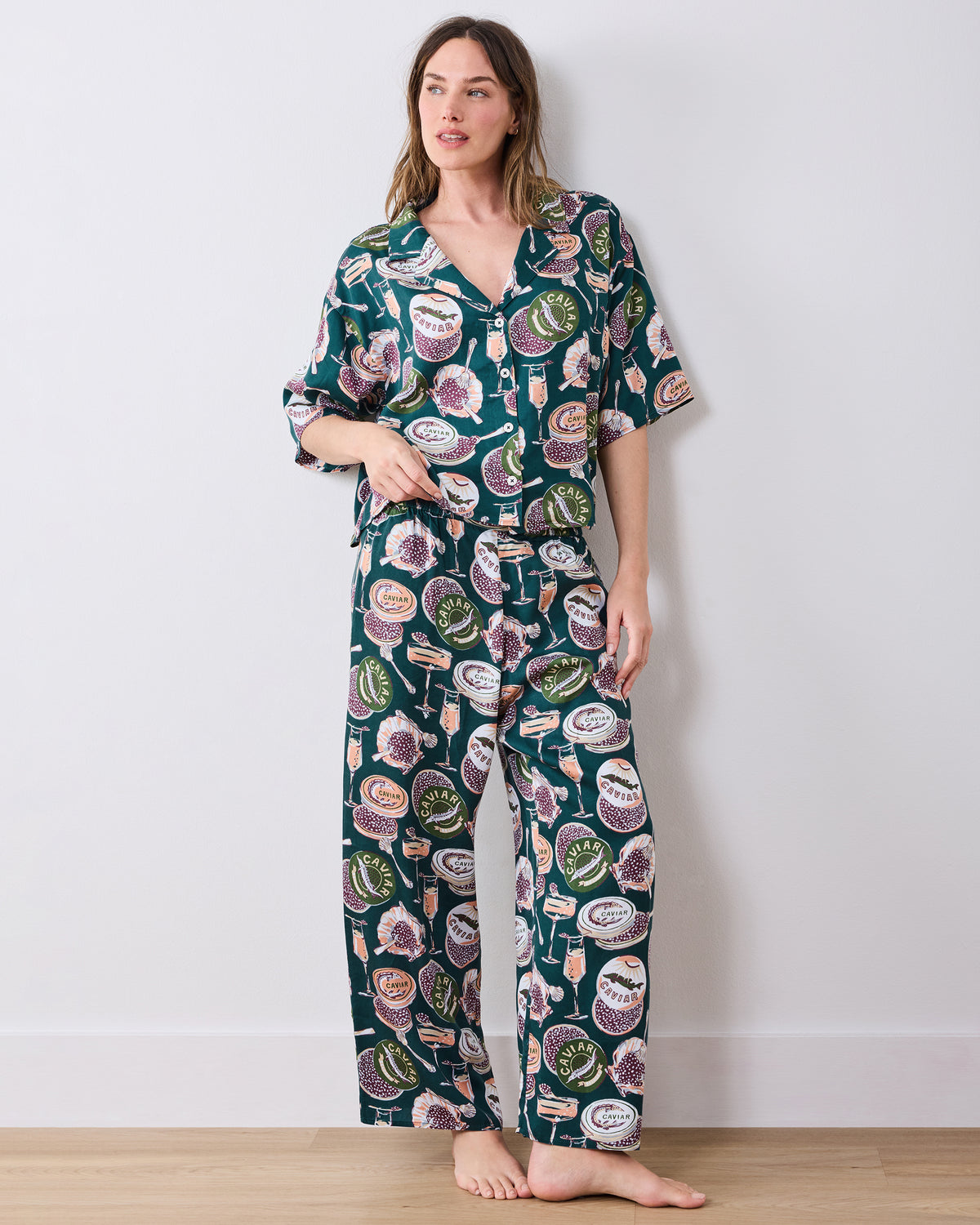Full front view of the Champagne & Caviar Wildest Dreams pajama set with a short-sleeve button-front top and wide-leg pants.