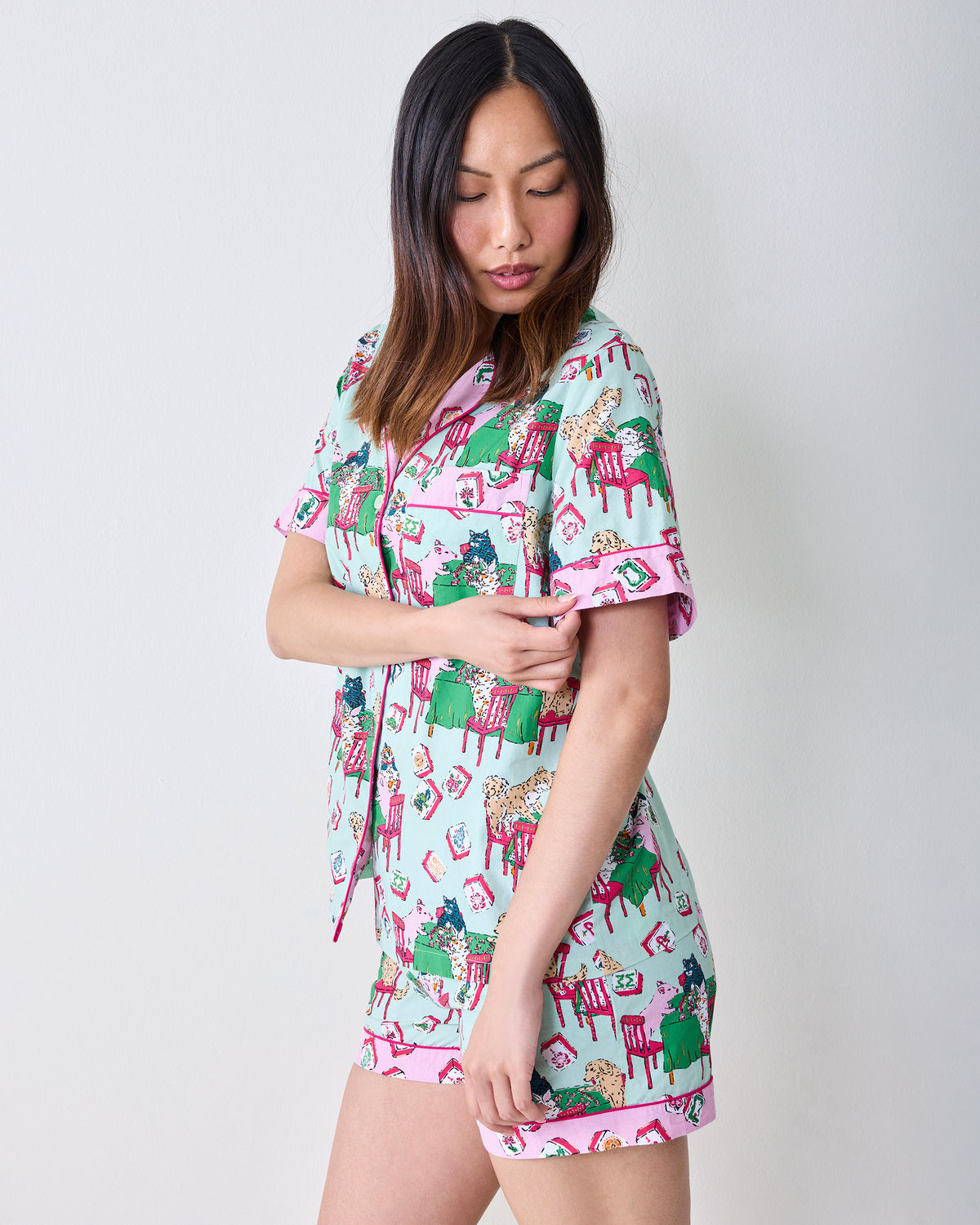 Model wearing the pale jade Mah Jongg Menagerie short pajama set with a button-front top and matching shorts.