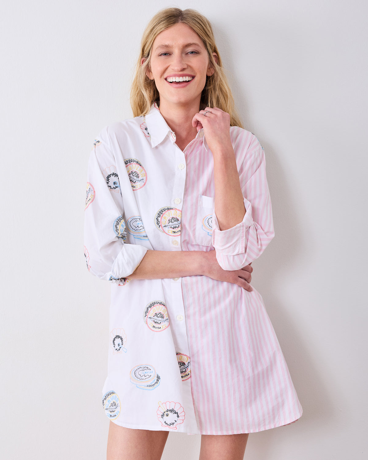 Front view of the Embroidered Caviar Club button-down sleep shirt, with caviar tin embroidery on one side and pink stripes on the other.