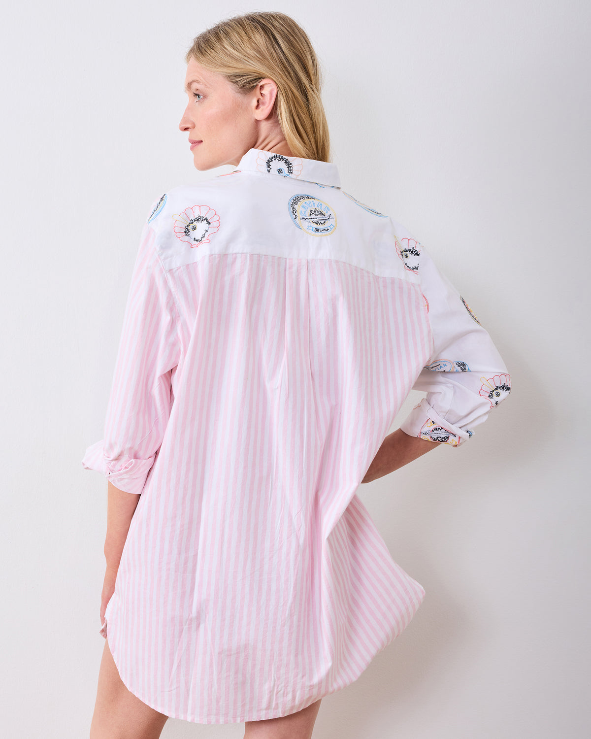 Back view of the Embroidered Caviar Club button-down sleep shirt, showing pink vertical stripes and embroidered caviar tin motifs.