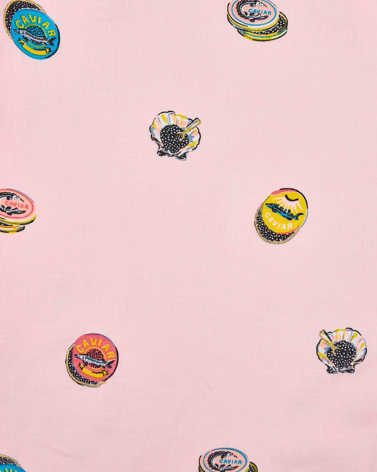 Close-up swatch of pink fabric with scattered embroidered caviar tins and shell motifs.