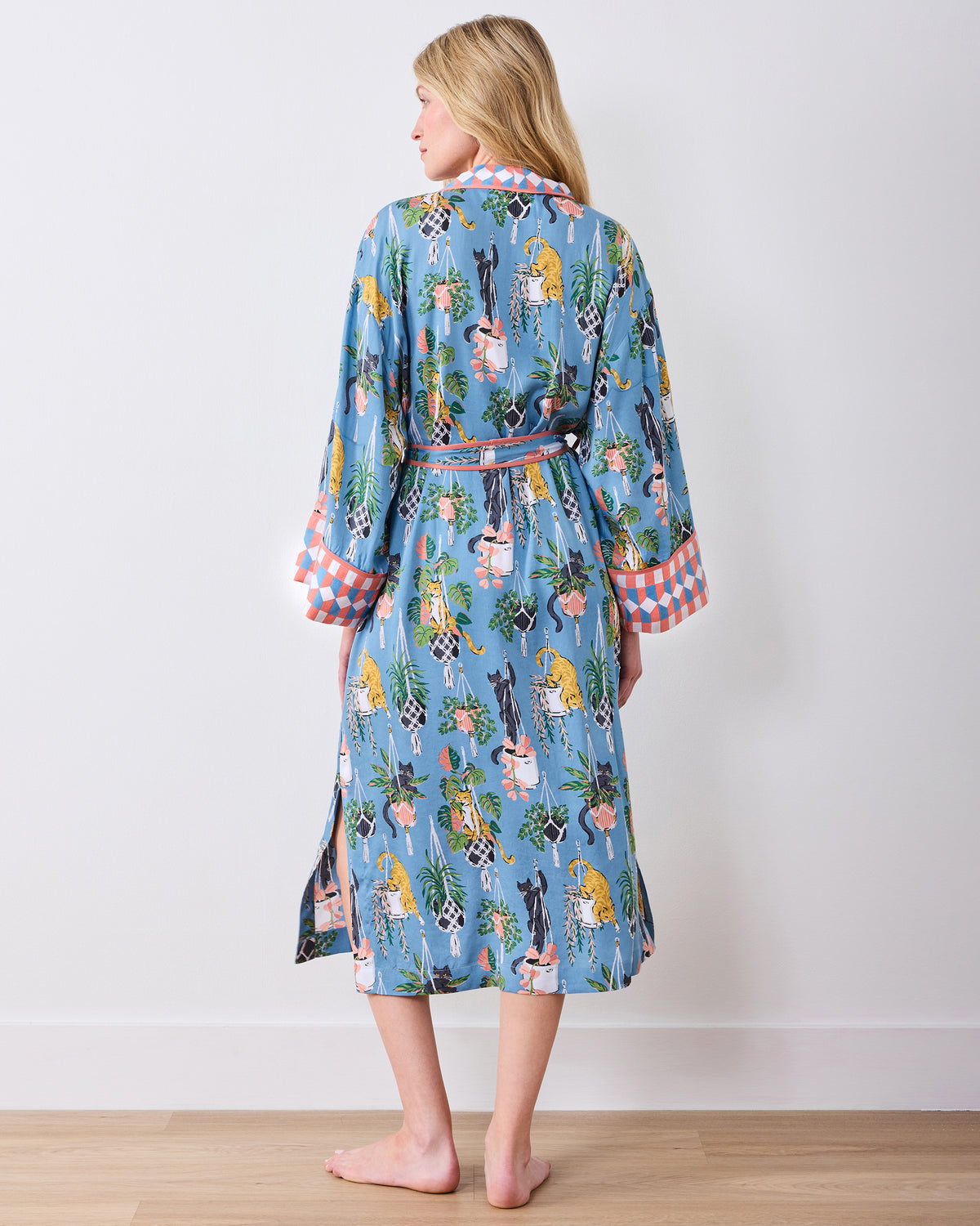 Full back view of the calf-length slate blue robe with belt and patterned cuffs