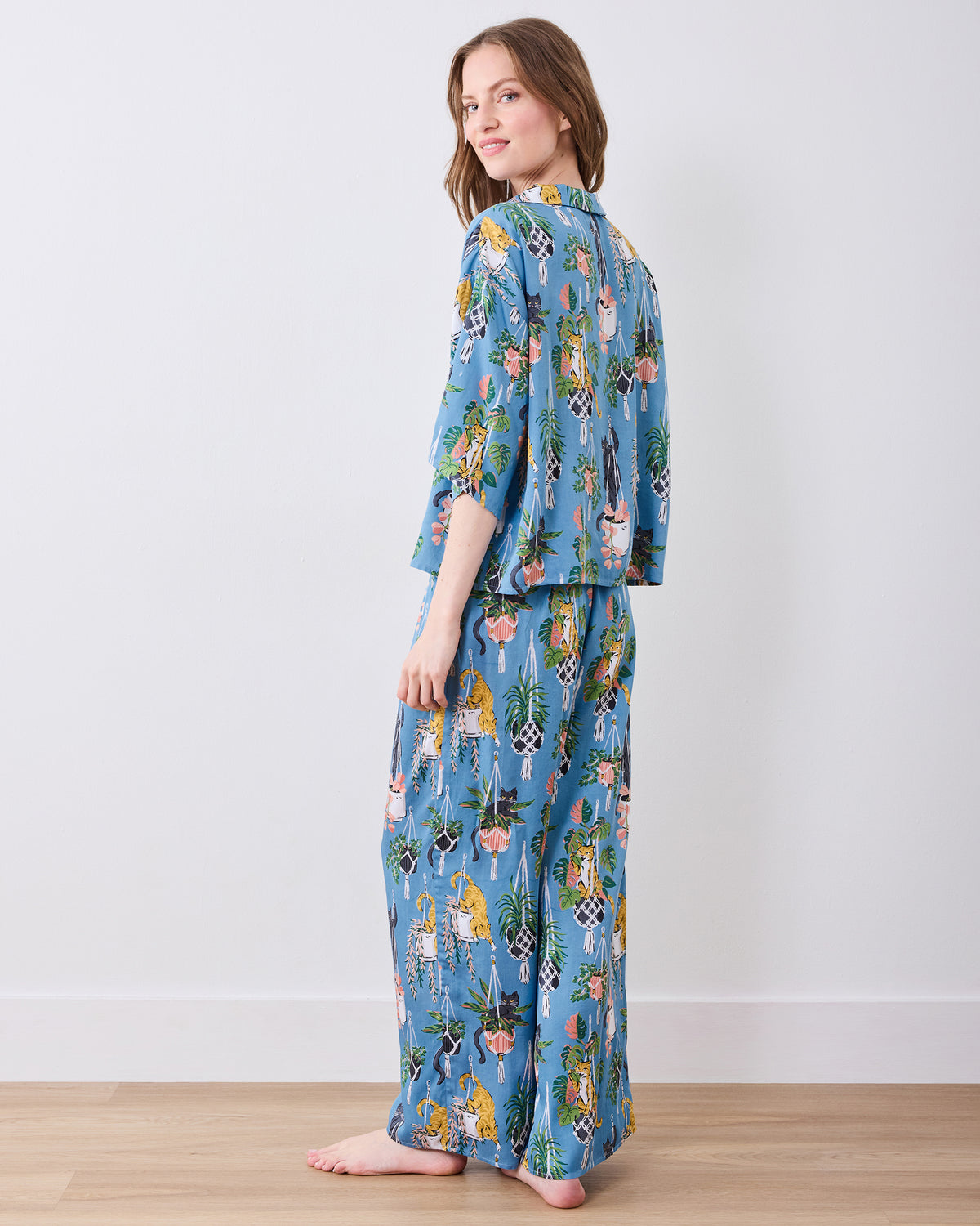 Full rear three-quarter view of the slate blue pajama set with wide-leg pants