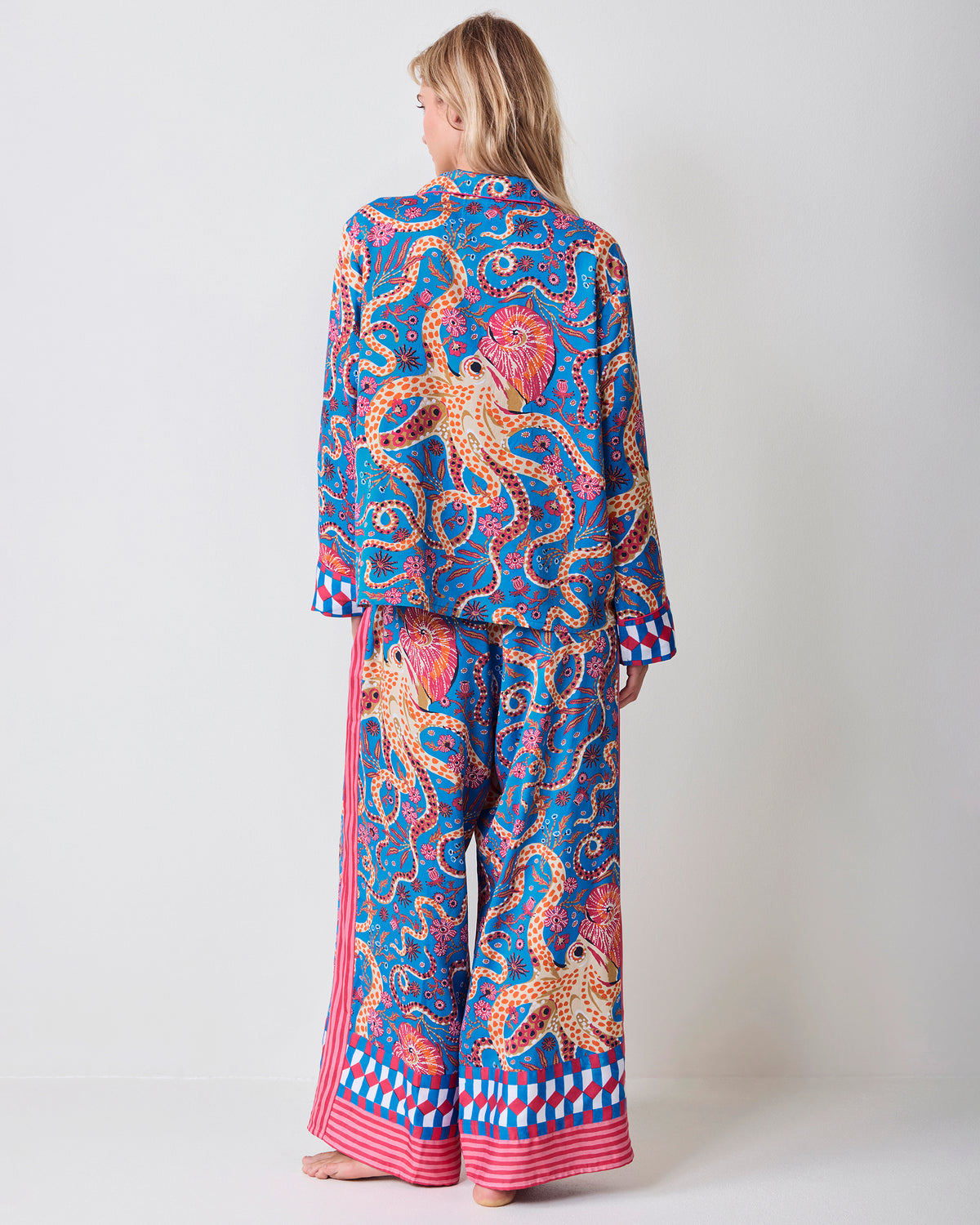 Back view of a model wearing the Octopus Isle pajama top and wide-leg pants