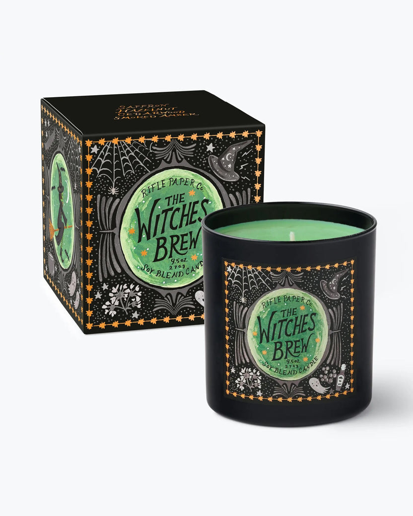 Black Witches Brew candle with green wax shown beside its illustrated gift box.