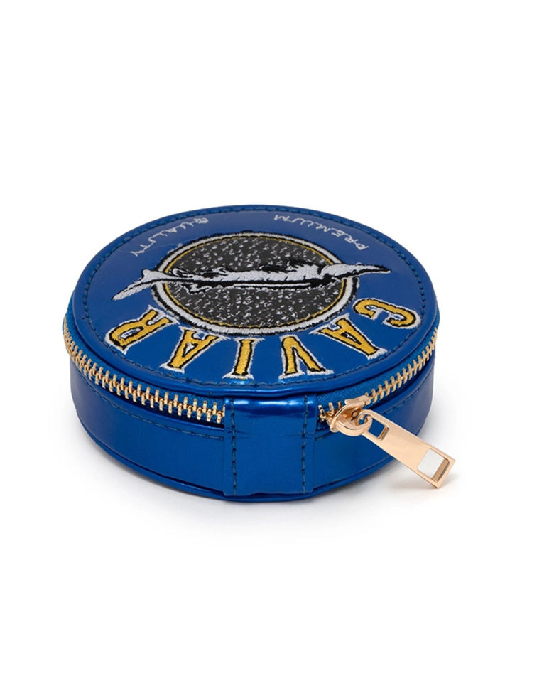 Blue Caviar Daily Pill Case shown from the side with its gold zipper and pull tab.