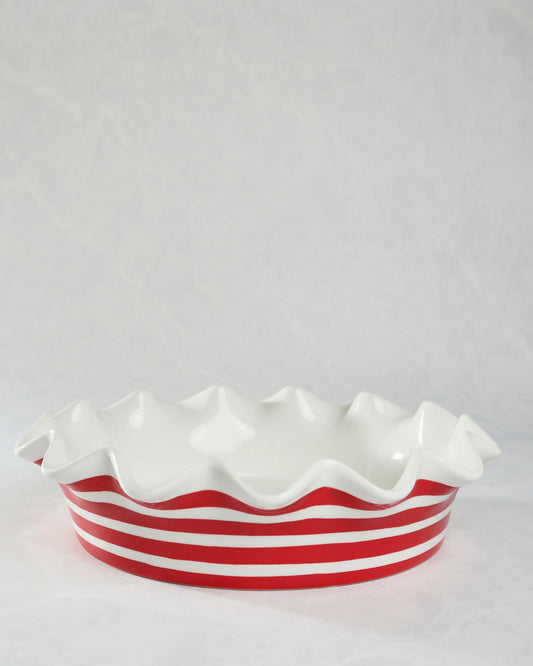 Red-and-white striped ceramic ruffle pie dish shown in a front side view.