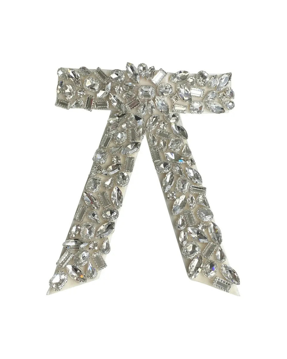 Cream bow-shaped barrette hair clip embellished with clear faceted stones.