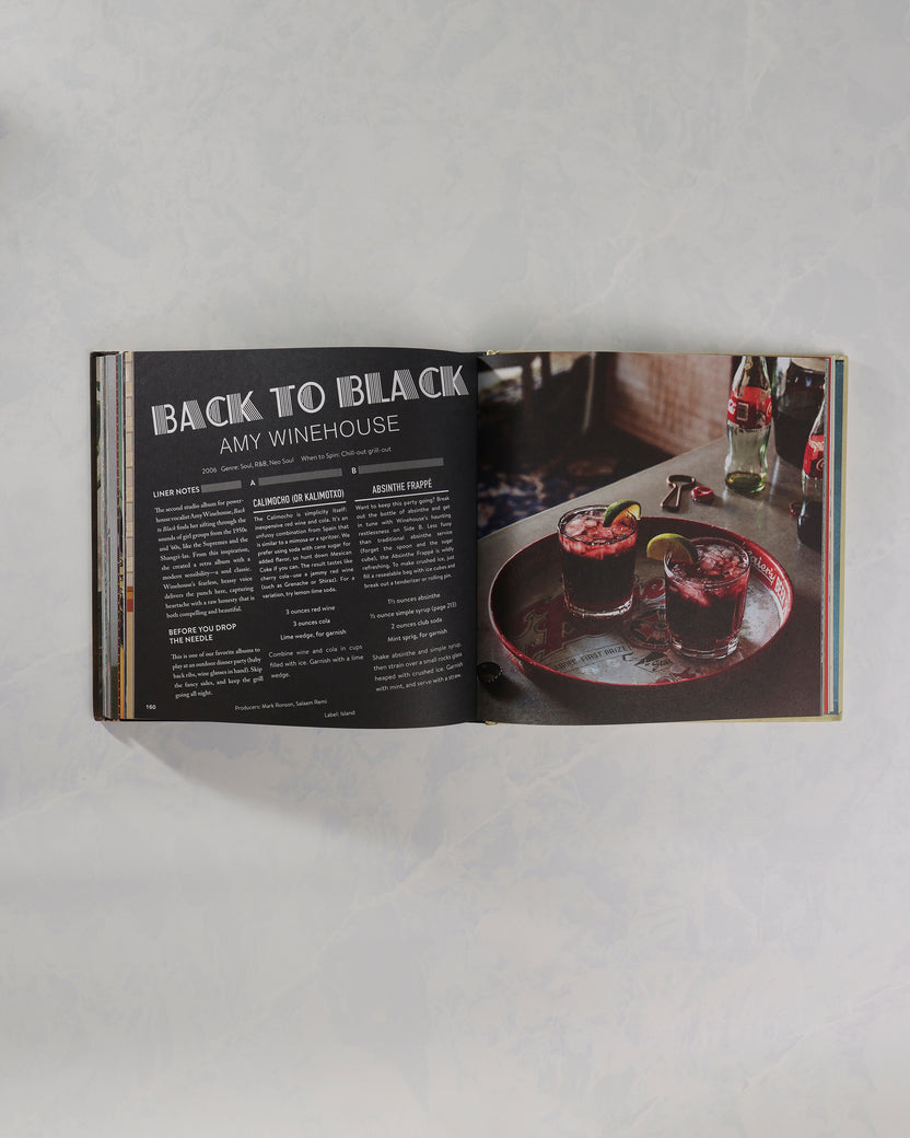 Open Booze & Vinyl book showing an Amy Winehouse entry beside a photograph of two drinks.