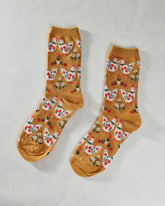 Mustard County Chick crew socks displayed side by side, with repeating chickens and flowers.