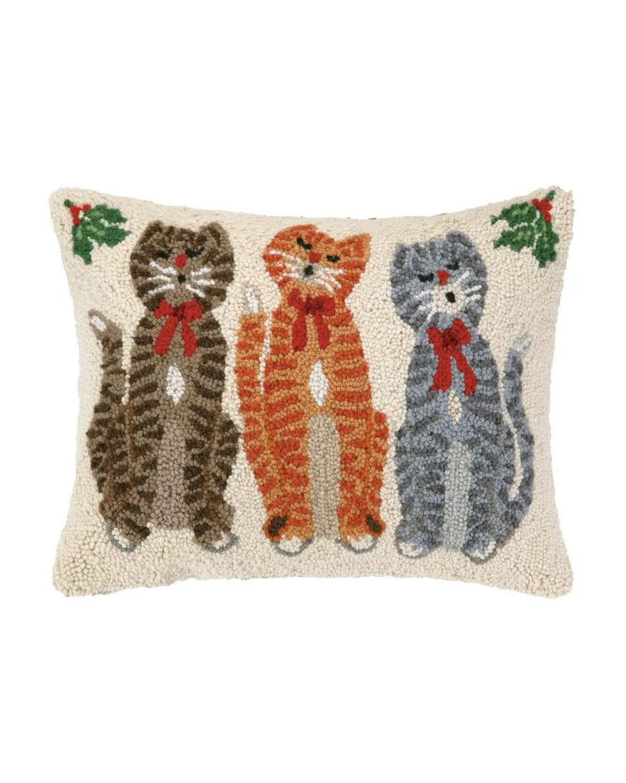 Front of ivory hooked pillow featuring three striped cats wearing red bows