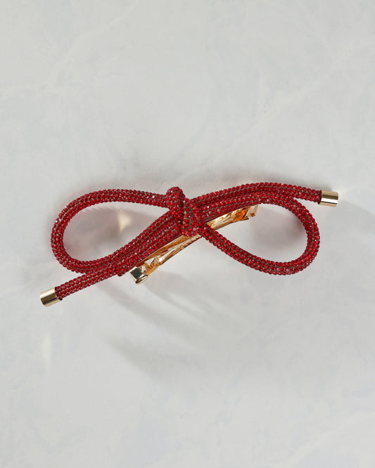 Red sparkling bow barrette shown from the front