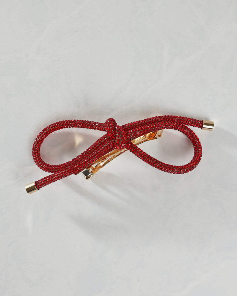 Red sparkling bow barrette shown from the front