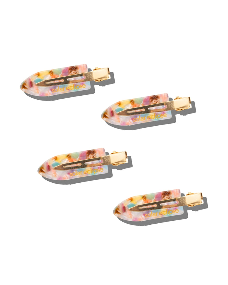Set of four multicolored hair clips with gold-tone metal fasteners