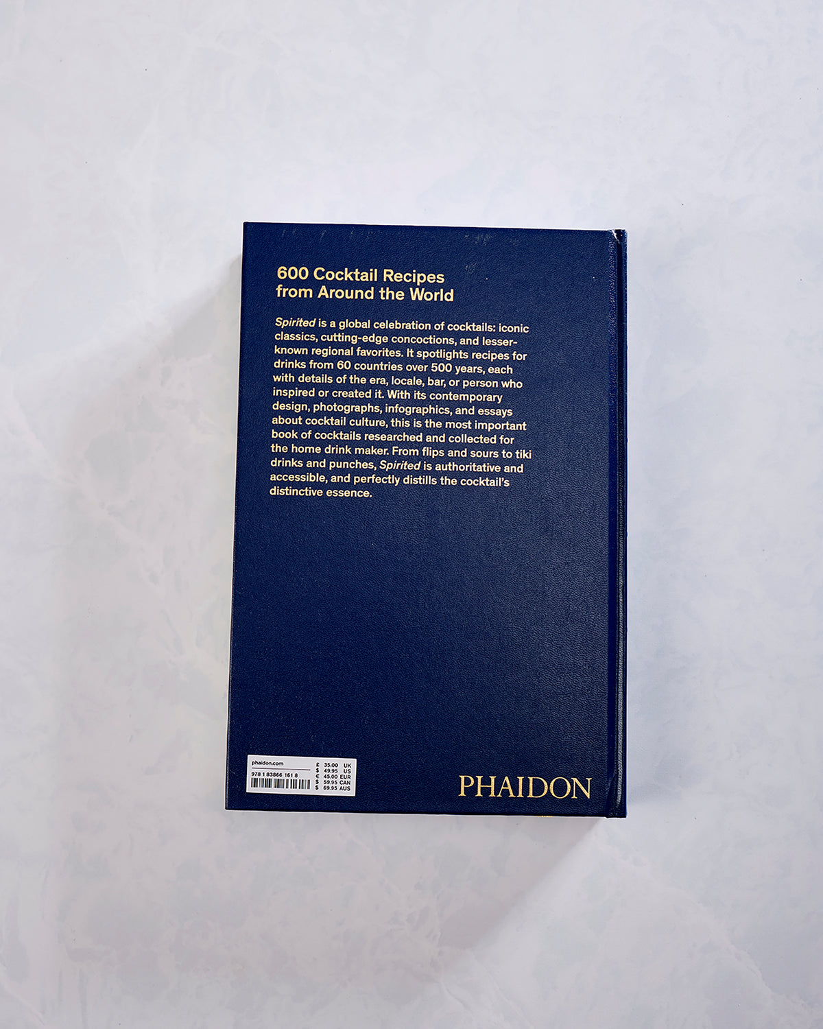 Back cover of Spirited: Cocktails from Around the World, with text describing 600 cocktail recipes and the Phaidon logo.