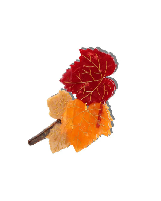 Claw hair clip shaped like a branch with red and orange maple leaves