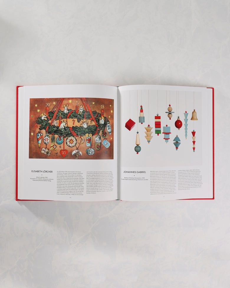 Open spread from The Christmas Book showing a vintage numbered Christmas calendar illustration beside a page of hanging geometric ornaments.