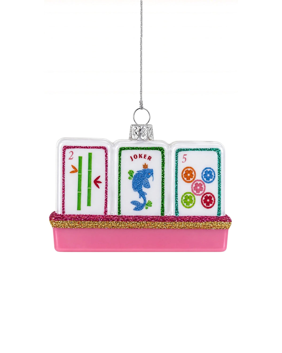 Glass mahjong tile ornament with three illustrated tiles, including tiles marked 2, JOKER, and 5, on a pink glitter-trimmed base.