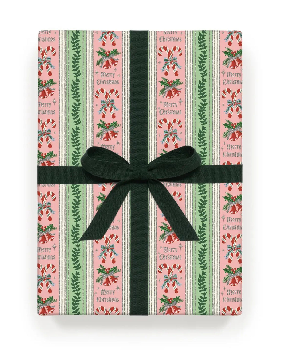 Ribbon-wrapped roll of pink Christmas wrapping paper with vertical green and cream stripes, candy canes, bells, holly, and repeated “Merry Christmas” text.
