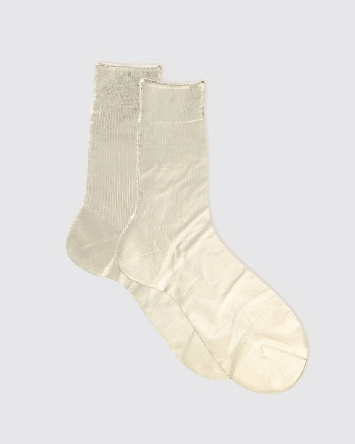 Single cream-colored ribbed metallic-finish sock shown against a light background