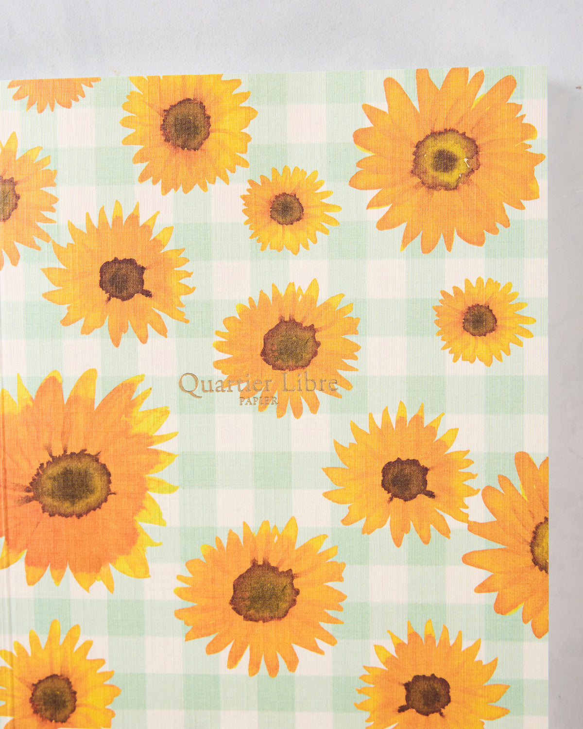 Sunflower journal cover with orange sunflowers on a pale green-and-white checkered background.