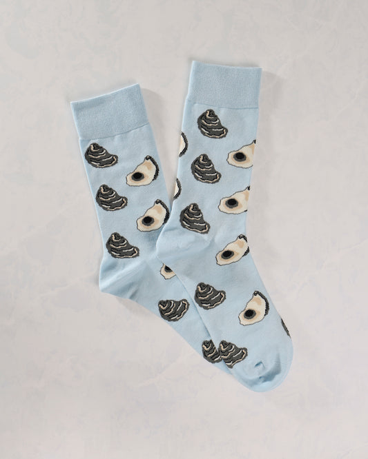 Pair of light blue socks patterned with dark oyster shells and white oyster halves.