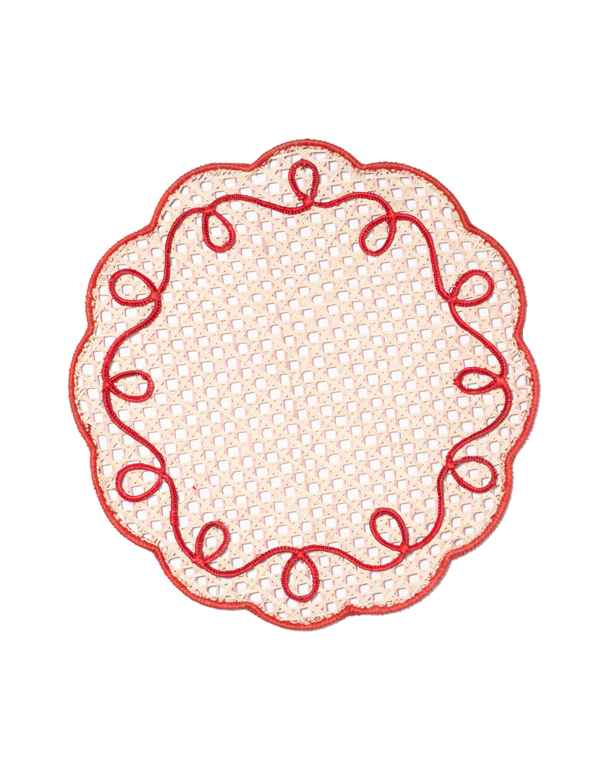 Round scalloped red ribbon lace placemat with a pale lattice center and looping red trim.