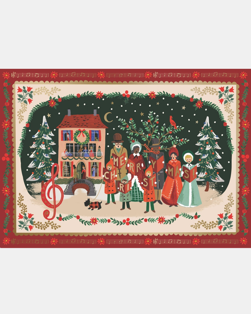 Completed Christmas carol puzzle showing carolers, a decorated house, Christmas trees, and a sheet-music border.