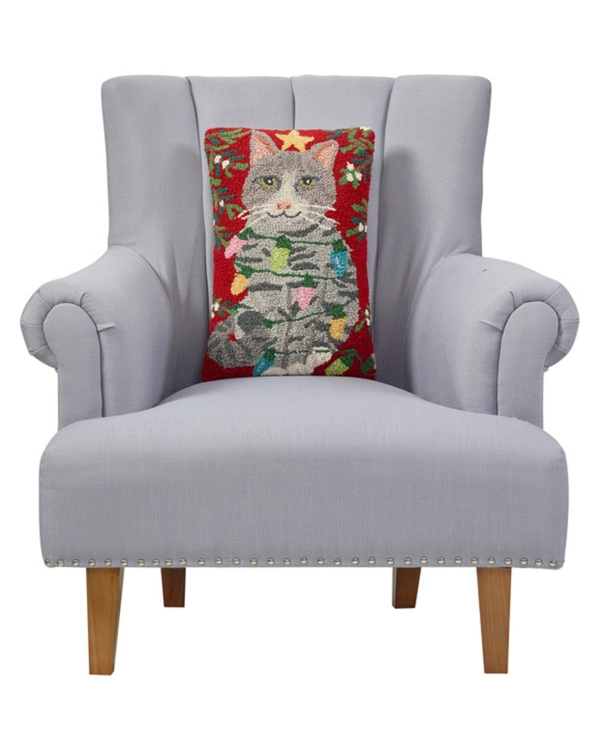 Red rectangular cat hook pillow displayed against the back of a light gray armchair