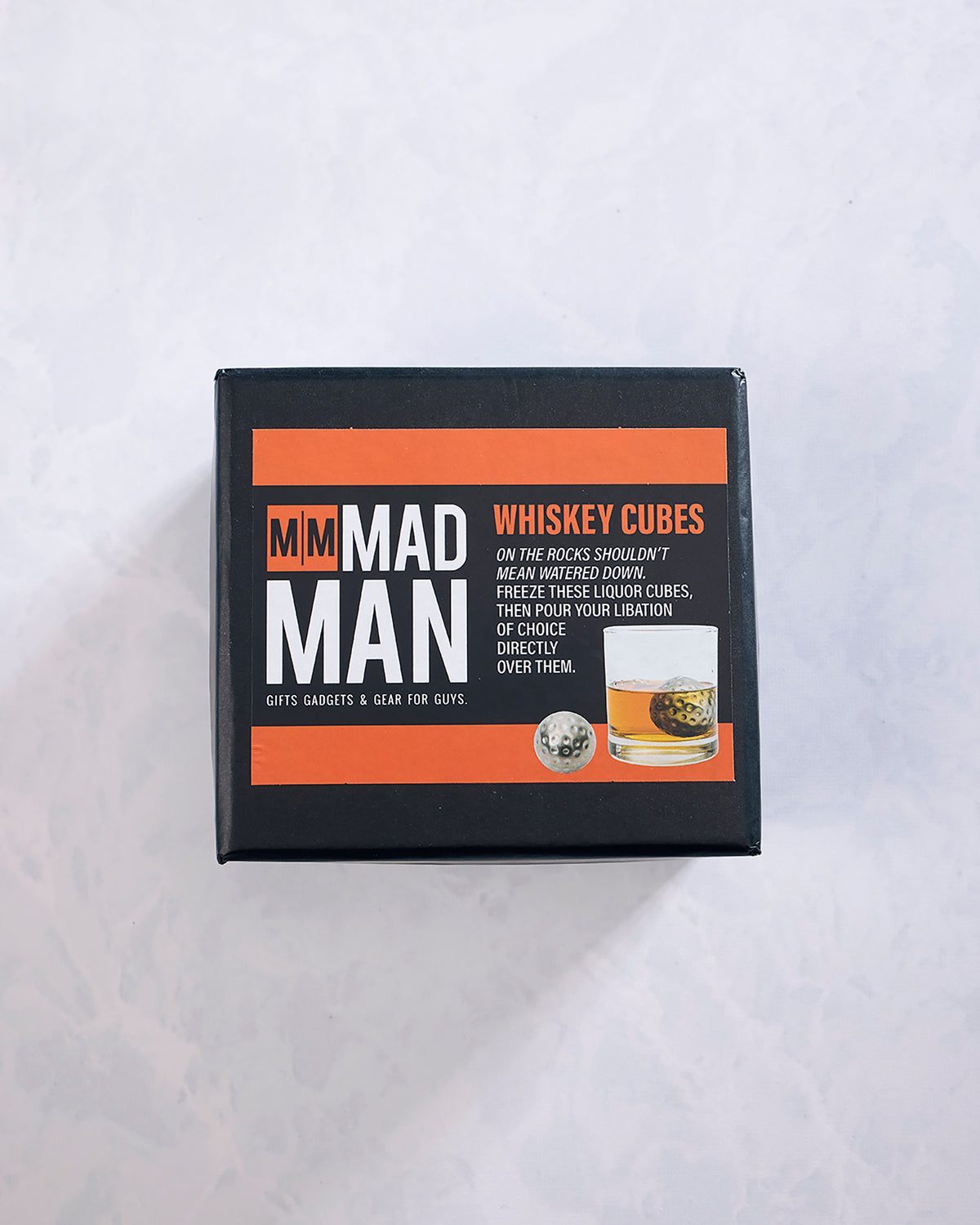 Box of six stainless steel whiskey chilling cubes, shown in black packaging with orange and white labeling.