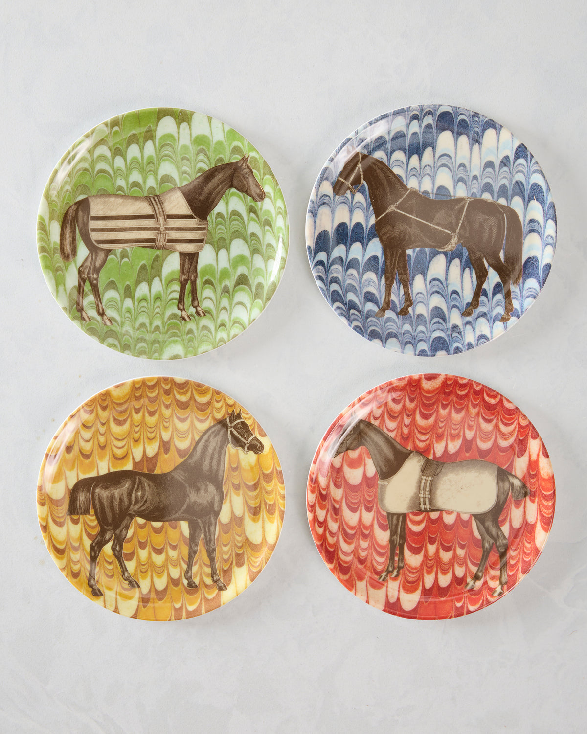 Set of four round horse coasters, each with a different horse illustration and a green, blue, yellow, or red marbled background.