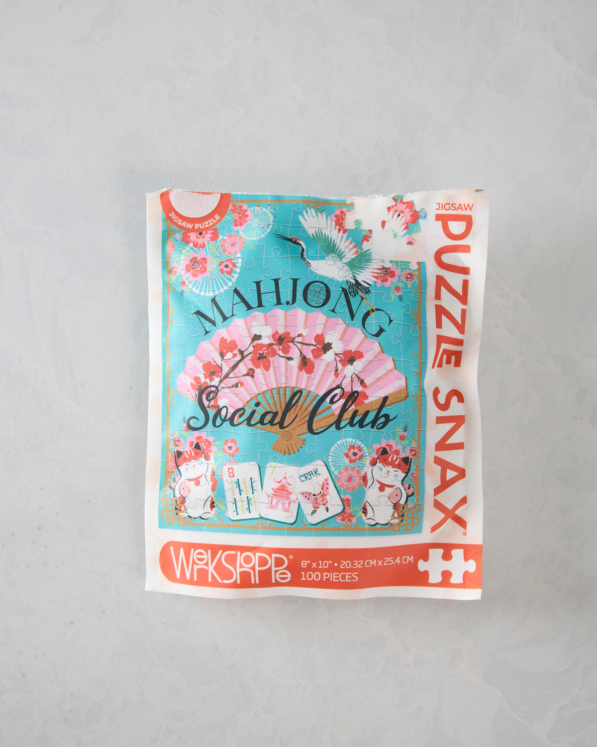 Front view of the packaged 100-piece Mahjong Social Club jigsaw puzzle.