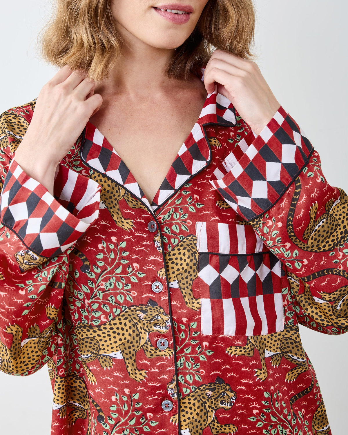 Close view of the scarlet Bagheera satin pajama top with checked collar, cuffs, buttons, and chest pocket