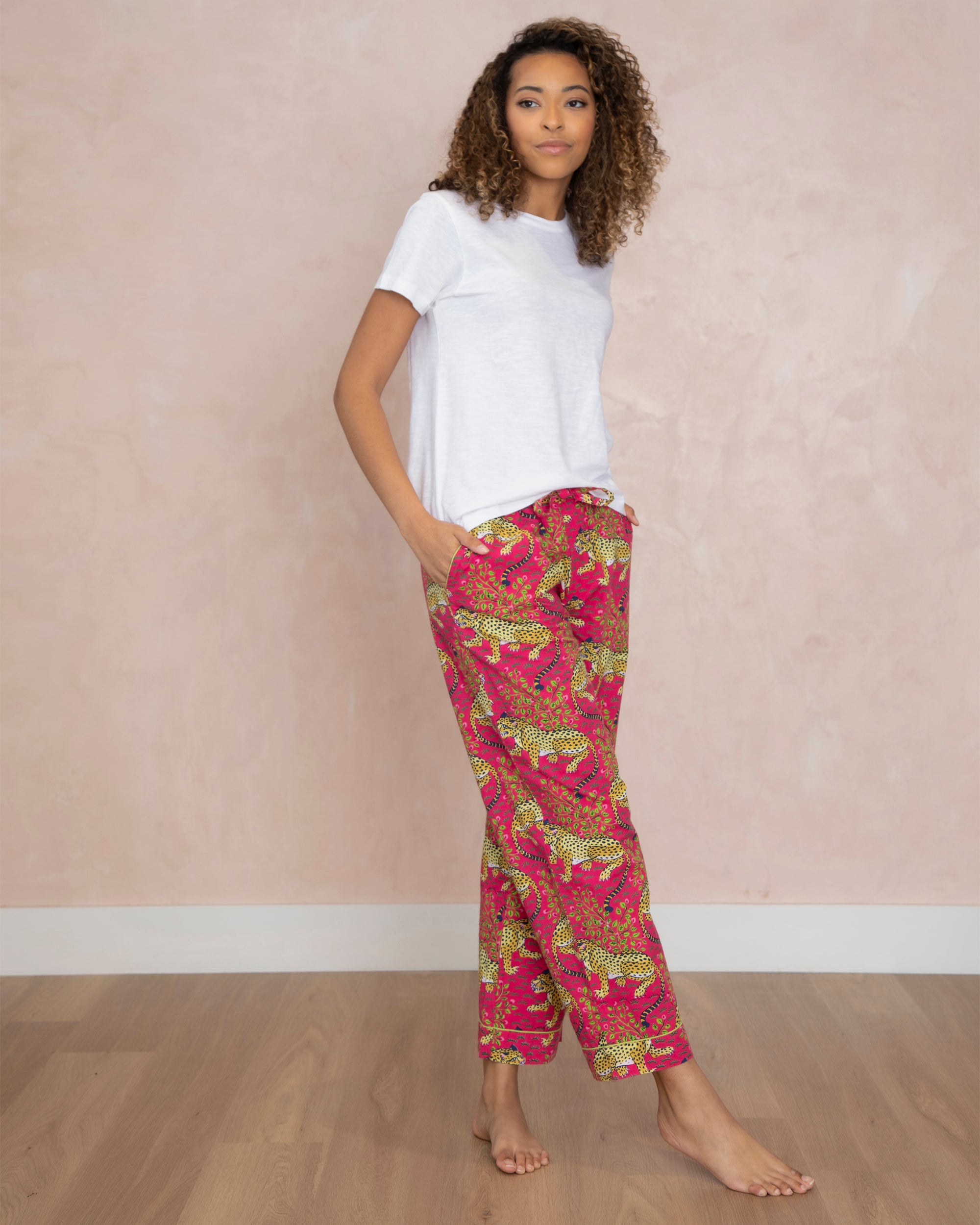 Free Photos - A Female Fashion Model Posing For A Photo Shoot, Wearing Pink  Pants And A White Shirt. She Is Turning Her Head To The Side, Giving A  Profile View Of